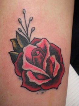 tattoo picture of traditional rose tattoo with minimal color use