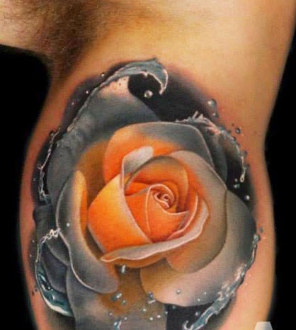 Realistic Rose Tattoo by Andres Acosta on bicep picture with water drops formation
